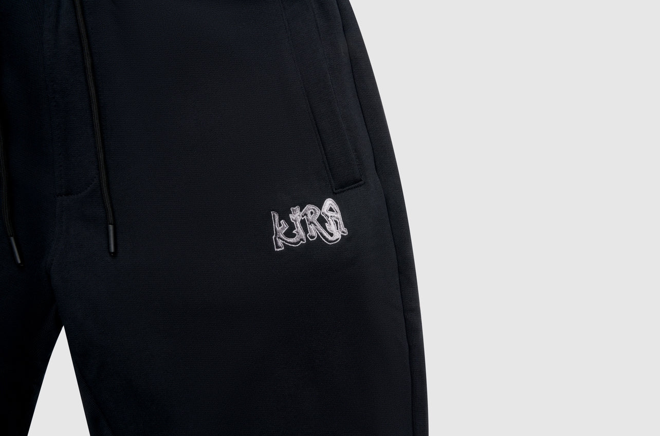 • Pantalon jogging noir